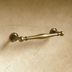 Polished nickel cabinet pull with curved bar and decorative bases, shown front view against white background.