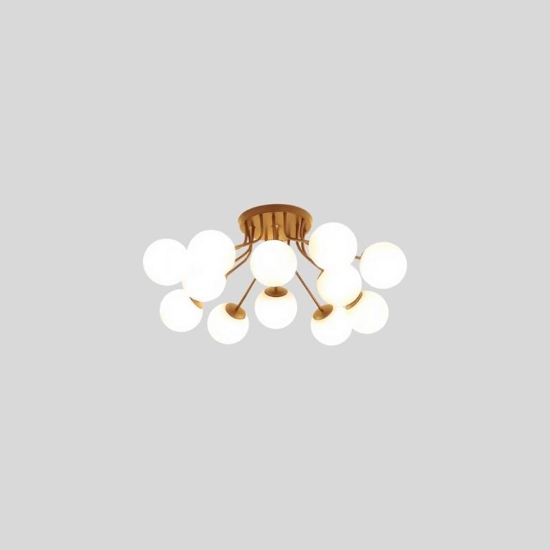 "An 11-light ceiling light with spherical glass shades and a gold iron frame."