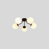 "A 5-light ceiling light with spherical glass shades and a black iron frame."