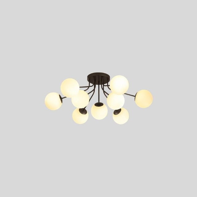 "A 9-light ceiling light with spherical glass shades and a black iron frame."