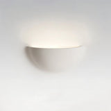 "Sleek, minimalist, half-moon shaped trimless light made of gypsum and metal, seamlessly integrated into a white wall, providing a soft, ambient glow for modern interiors."