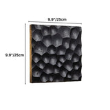 "Black travertine wall lamp with hexagonal pattern, showing dimensions of 9.9 inches or 25 centimeters on a white background."
