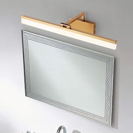 "A brushed gold LED vanity light with an adjustable arm, mounted above a decorative bathroom mirror and sink."