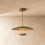 Modern pendant light fixture with tiered disc shades and metal pipe, shown against white background.