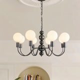 "Walfi chandelier with iron frame and frosted glass globes hanging in a living room with a bookshelf."