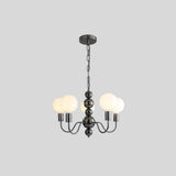 "Modern sculptural chandelier with a black iron frame, multiple curved arms, and frosted glass globes providing soft ambient lighting."