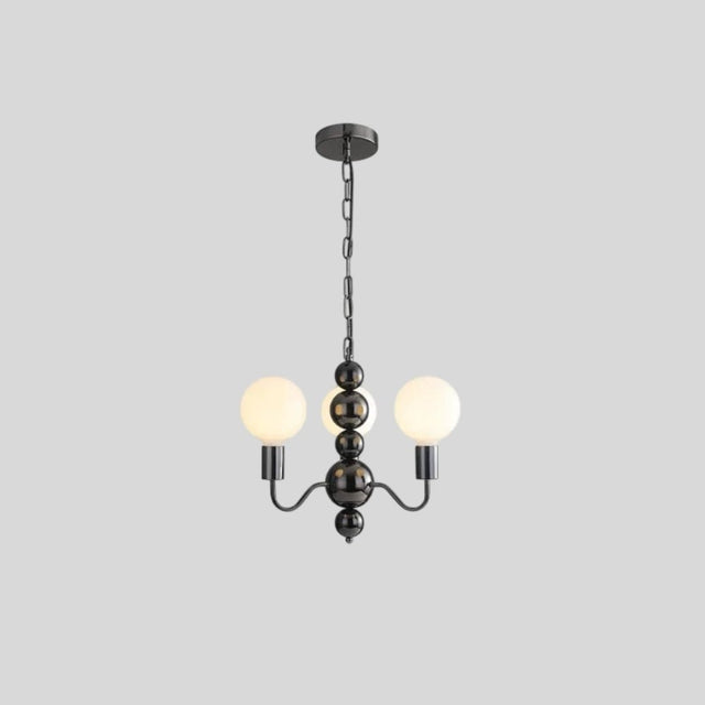 "Modern sculptural chandelier with a black iron frame, curved arms, and frosted glass globes, providing soft ambient lighting."