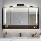"A modern, curved LED wall lamp illuminating a bathroom mirror cabinet with a sink."