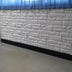 Wenar Wall Panel used as interior wall cladding beneath a window, highlighting its textured PVC surface and modern appeal.