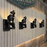 Lámpara de pared con cara susurrante