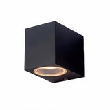 "Modern cubic outdoor wall lamp with a dark aluminum body and glass diffuser, providing focused illumination."