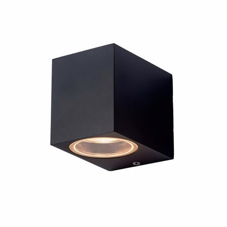 "Modern cubic outdoor wall lamp with a dark aluminum body and glass diffuser, providing focused illumination."