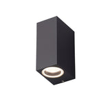 "A modern black aluminum outdoor wall lamp with a sleek, minimalist design, showing the front view and light."