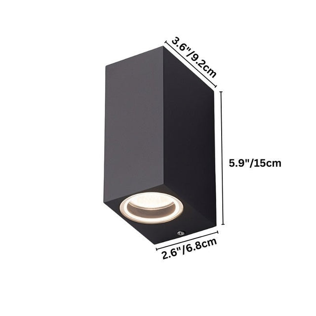 "Vertical dimensions of a modern cubic outdoor wall lamp with a dark aluminum body and glass diffuser: 5.9 inches in height, 3.6 inches in width, and 2.6 inches in depth."