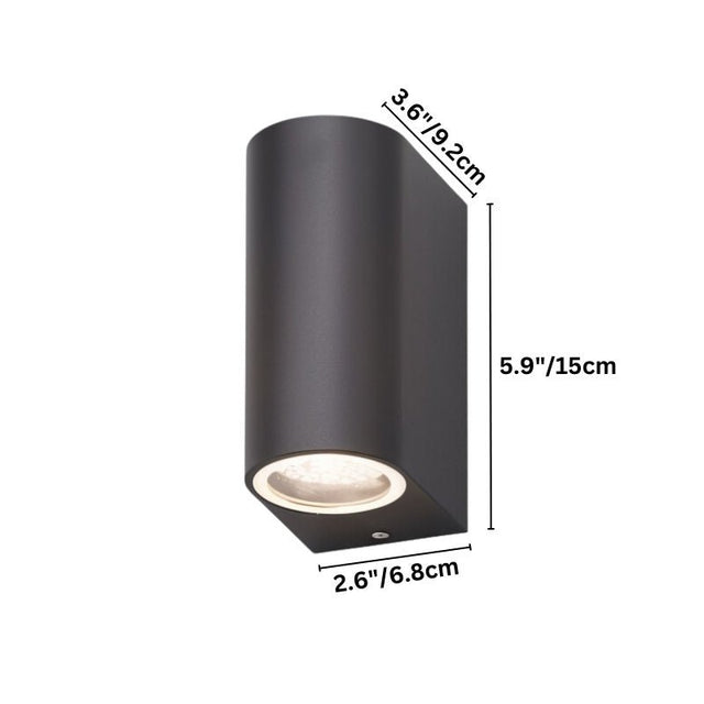 "Vertical dimensions of a modern outdoor wall lamp with a dark aluminum body and glass diffuser: 5.9 inches in height, 3.6 inches in width, and 2.6 inches in depth."