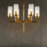 Wynlo Chandelier – compact copper light fixture with six glass shades, ideal for bedrooms or smaller modern interiors.