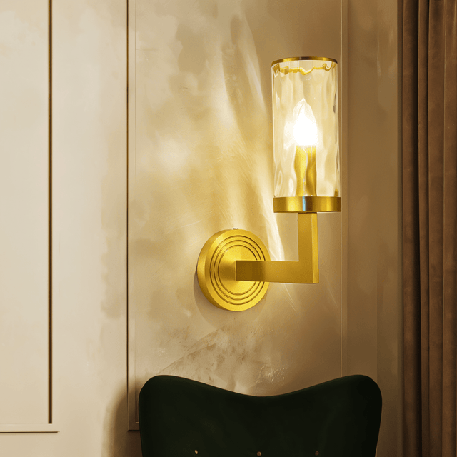 Wynlo Copper Walllamp with ripple glass shade mounted on a cream wall, casting elegant ambient lighting in a modern interior.
