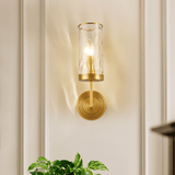 Front view of Wynlo Copper Walllamp with ripple glass shade, mounted on a white paneled wall above green indoor plants.