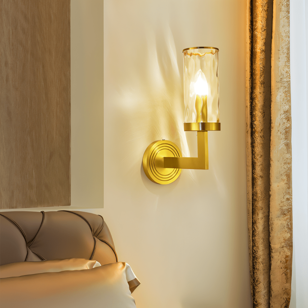 Wynlo Copper Walllamp beside a tufted headboard in a bedroom, offering warm ambient lighting through its ripple glass shade.