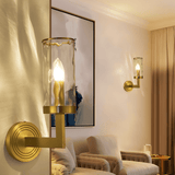 Pair of Wynlo Copper Walllamps illuminating a cozy living room with beige seating and contemporary wall art, enhancing ambient lighting.