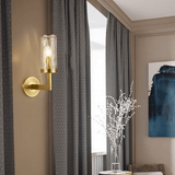 Wynlo Copper Walllamp on a taupe wall with blue curtains, adding elegant ambient lighting to a modern indoor space.
