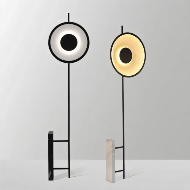 "A set of two halo floor lamps with different light colors, showcasing their sculptural designs and modern aesthetics."