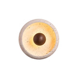 "Front view of a minimalist, circular travertine wall lamp with a warm wooden centerpiece, showcasing its blend of organic and modern design."