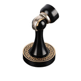 "Elegant, sculpted brass door stop with a black and gold finish, tapered design, magnetic hold, and decorative base, designed to prevent wall damage in modern and classic interiors."
