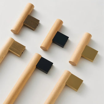 "Minimalist wood and brass knobs and pull bars, showcasing a sleek, geometric design for contemporary interiors."