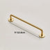 Brass pull bar handle with circular mounting plates on white background, measuring 5 inches.