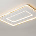Modern rectangular ceiling light with layered white and gold LED trim mounted on a white ceiling.