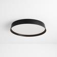 Zena Ceiling Lamp in black with flush-mounted minimalist design, ideal for modern interiors and ambient lighting in living or office spaces.
