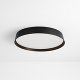 Zena Ceiling Lamp in black with flush-mounted minimalist design, ideal for modern interiors and ambient lighting in living or office spaces.