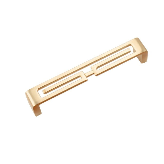 "A brushed gold, geometric pull bar with bold cutouts, made of zinc alloy, isolated on a white background."