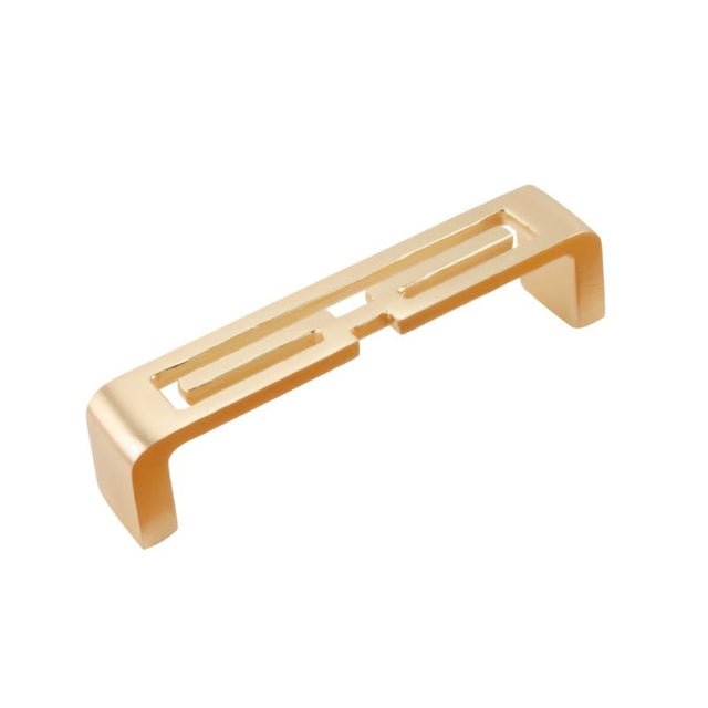 "A brushed gold, geometric pull bar with bold cutouts, made of zinc alloy, isolated on a white background."