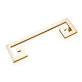 "A brushed gold, geometric pull bar with bold cutouts made of zinc alloy, isolated on a white background."