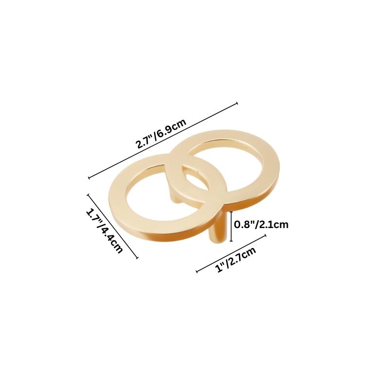 "A brushed gold, geometric knob with sharp, angular edges, made of zinc alloy, shown with dimensions."