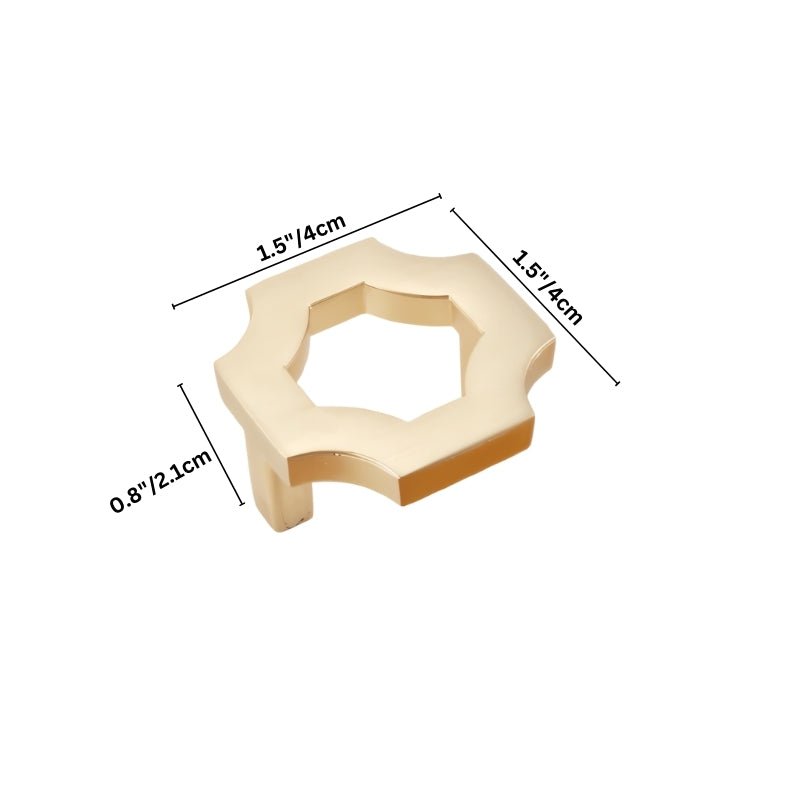 "A brushed gold, geometric knob with sharp, angular edges, made of zinc alloy, shown with dimensions."