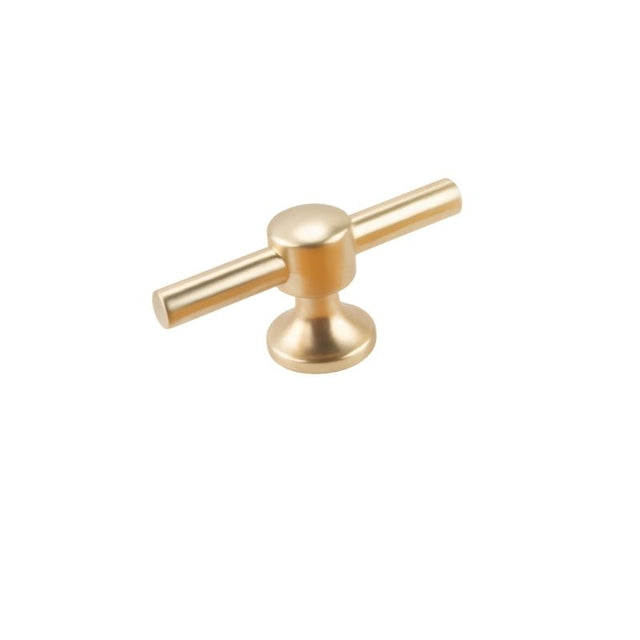 "A brushed gold, t-bar knob with rounded features, made of zinc alloy, isolated on a white background."
