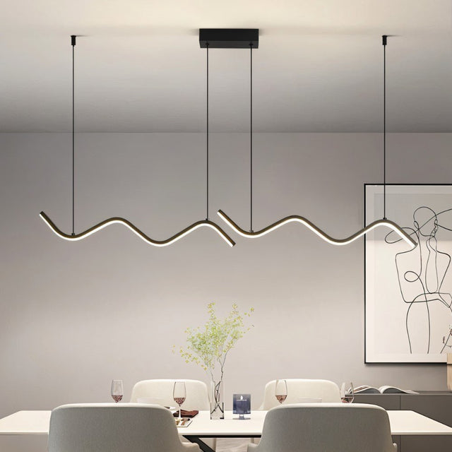 "A modern LED pendant light with fluid, wave-like bars, illuminating a dining table with place settings and artwork."