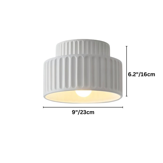"A white ceiling light with a ribbed, cylindrical shade, shown against a white background with dimension measurements."