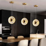 Zunel Pendant Light – Copper & Crystal Elegance trio in a sleek kitchen, offering ambient lighting above a marble island.