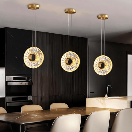 Zunel Pendant Light – Copper & Crystal Elegance trio in a sleek kitchen, offering ambient lighting above a marble island.