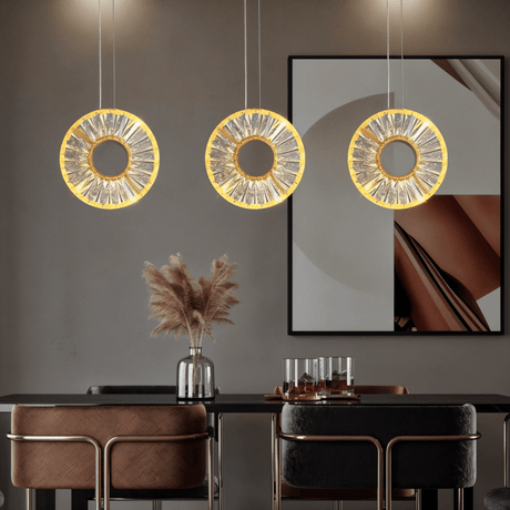 Zunel Pendant Light – Copper & Crystal Elegance trio above a dining table, enhancing contemporary decor with warm ambient lighting.
