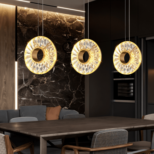 Zunel Pendant Light – Copper & Crystal Elegance set of three over a wooden dining table, blending with a marble-accented modern kitchen.