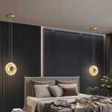 Zunel Pendant Light – Copper & Crystal Elegance pair above a bed, providing soft ambient lighting in a modern bedroom setting.
