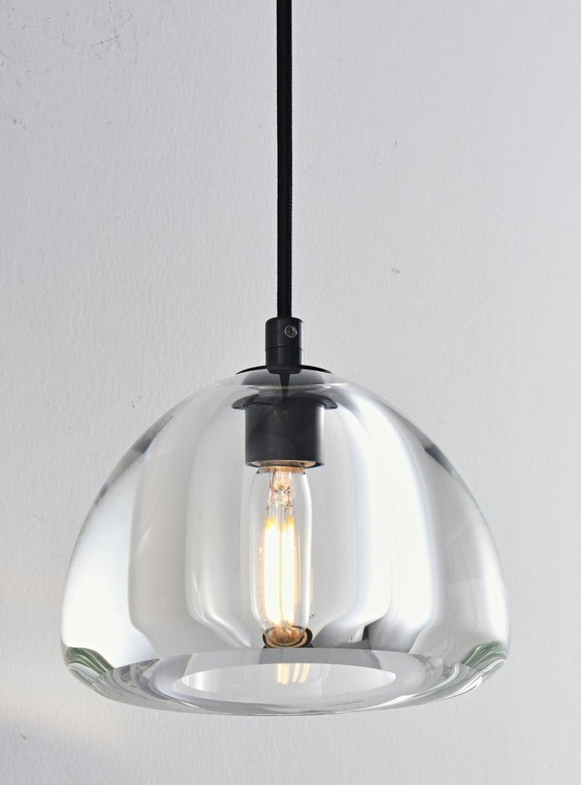 "A modern glass dome wall lamp with a clear shade and a visible light bulb, hanging from a black cord."