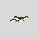 "A multi-piece geometric ceiling light with interlocking rectangular forms, isolated against a neutral background, showcasing its modern design."