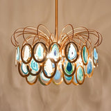 "A chandelier with an intricate iron frame and handcrafted agate stone accents."