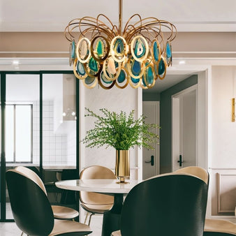 "An agate chandelier with an intricate iron frame in a dining room setting."